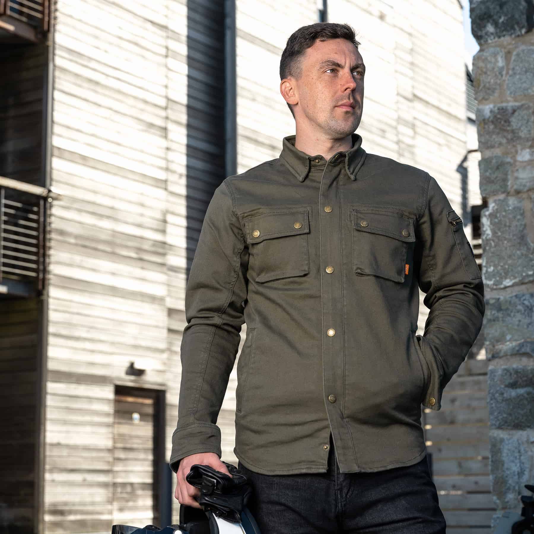 Lifestyle image of Merlin Brody D3O Single Layer Riding Shirt in olive