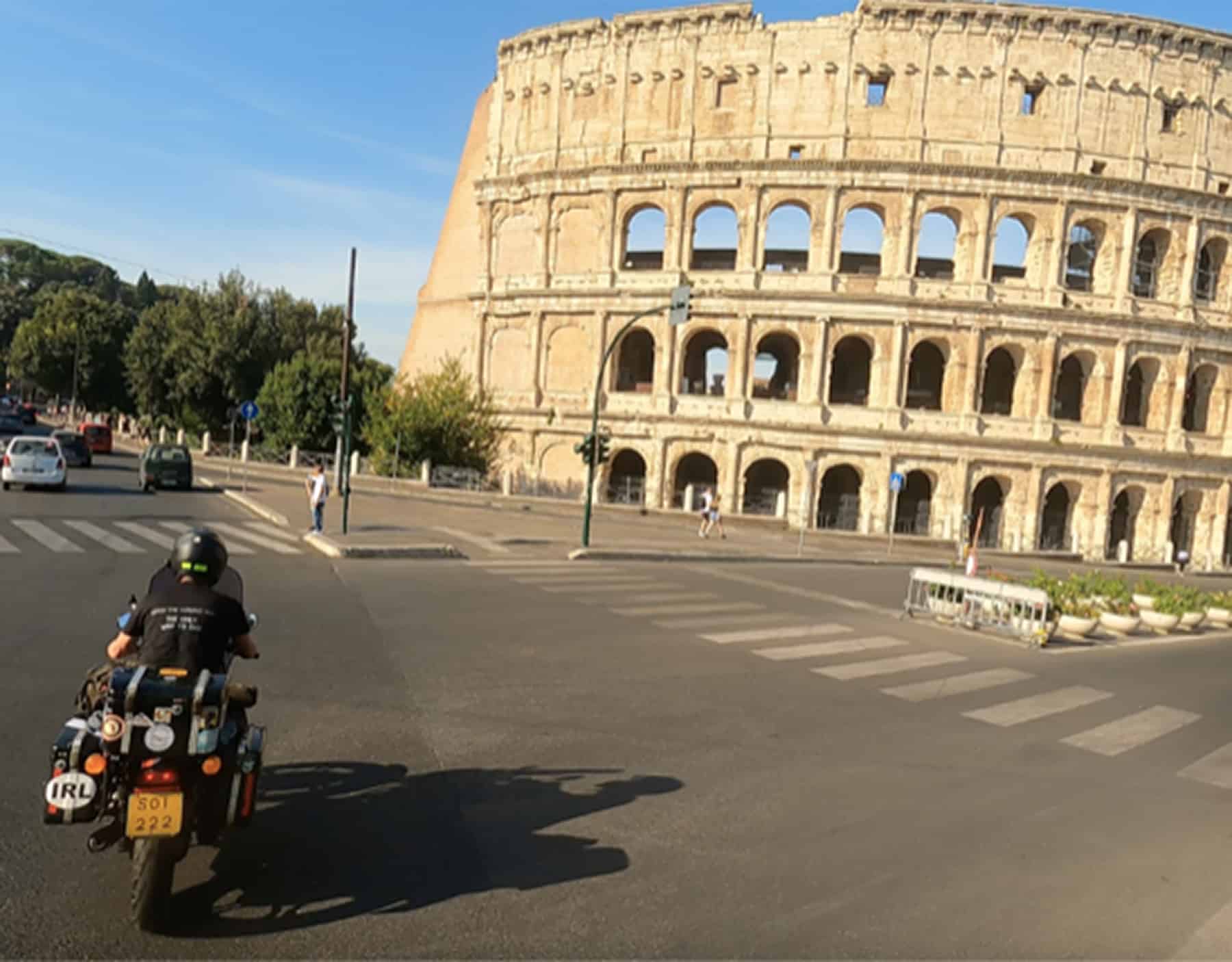 Chris Donaldson riding his 1977 Moto Guzzi Le Mans past the Colosseum in Rome